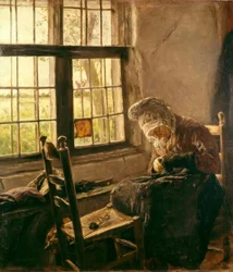 Stopfende alte Frau am Fenster